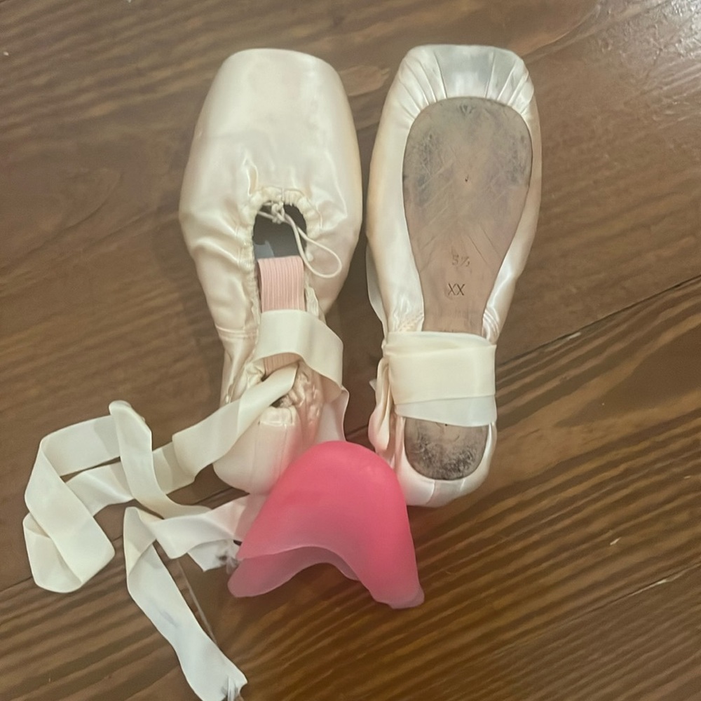 Gently used toe shoes including toe guards and bag